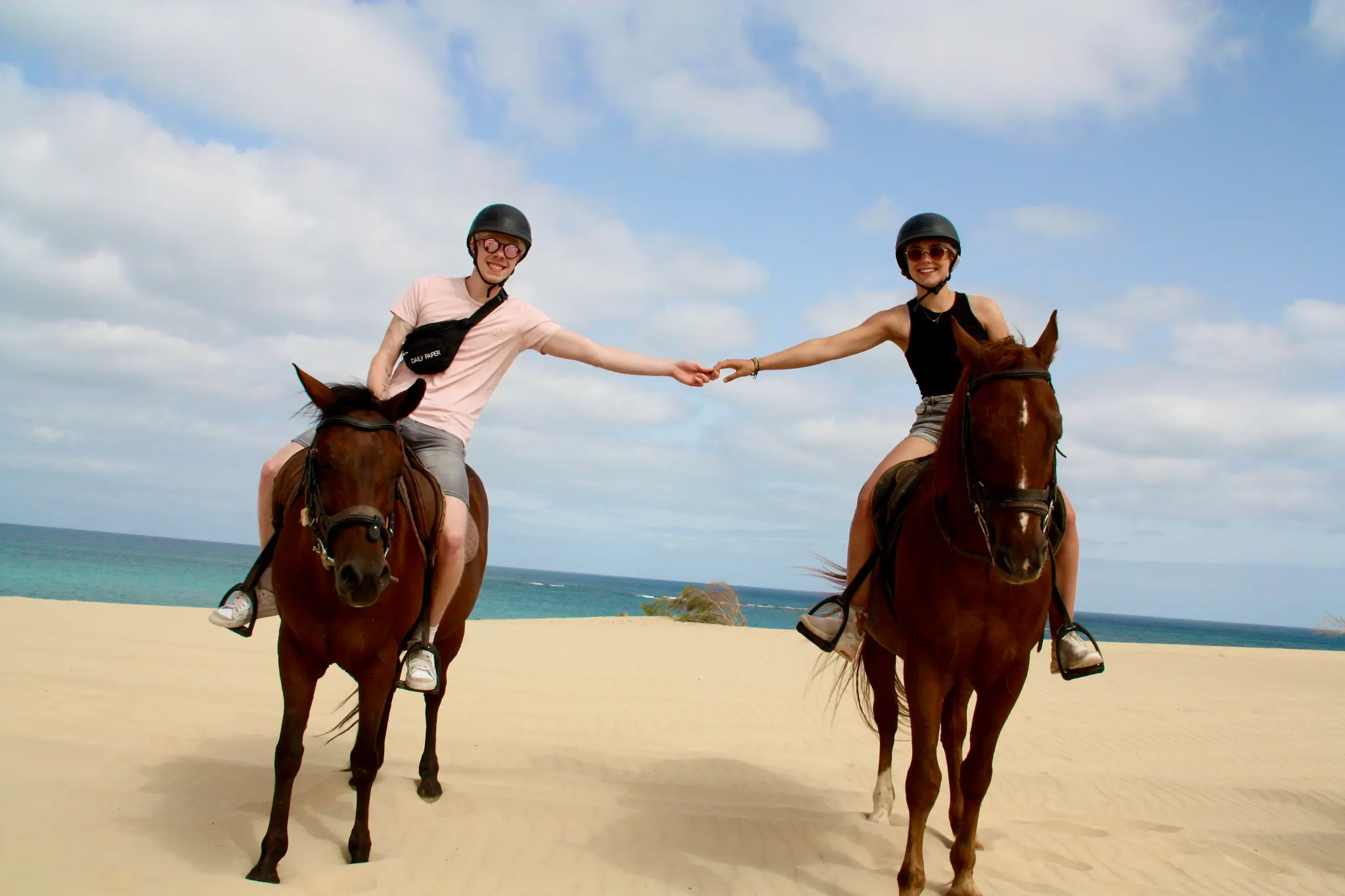 Couple sharing a special horseback moment in the dunes