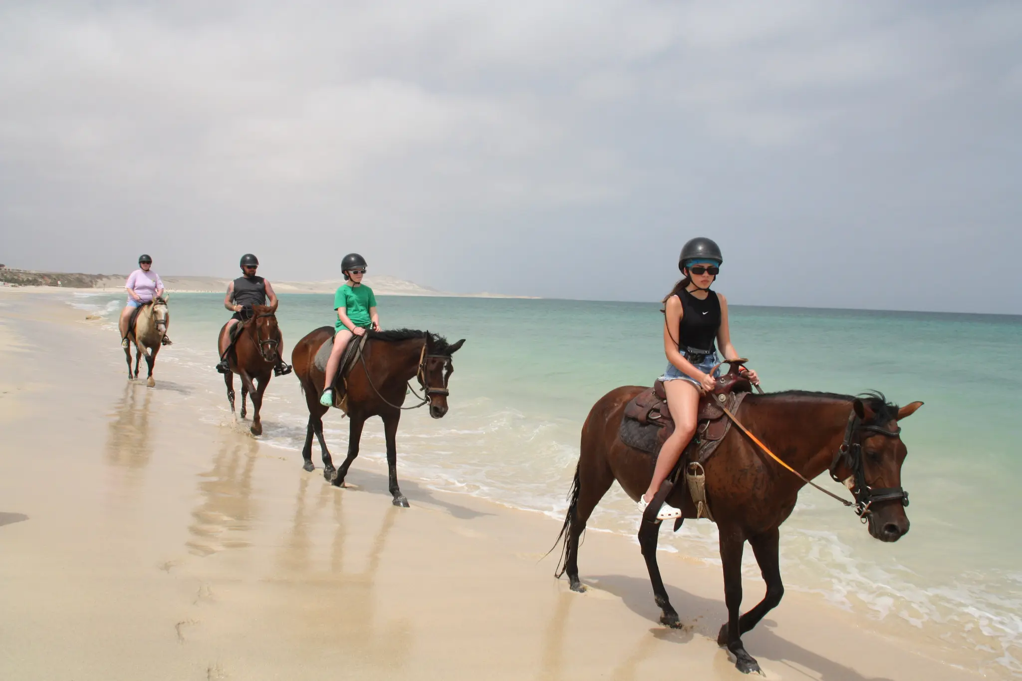Guided beginner group riding along the beach on Boa Vista
