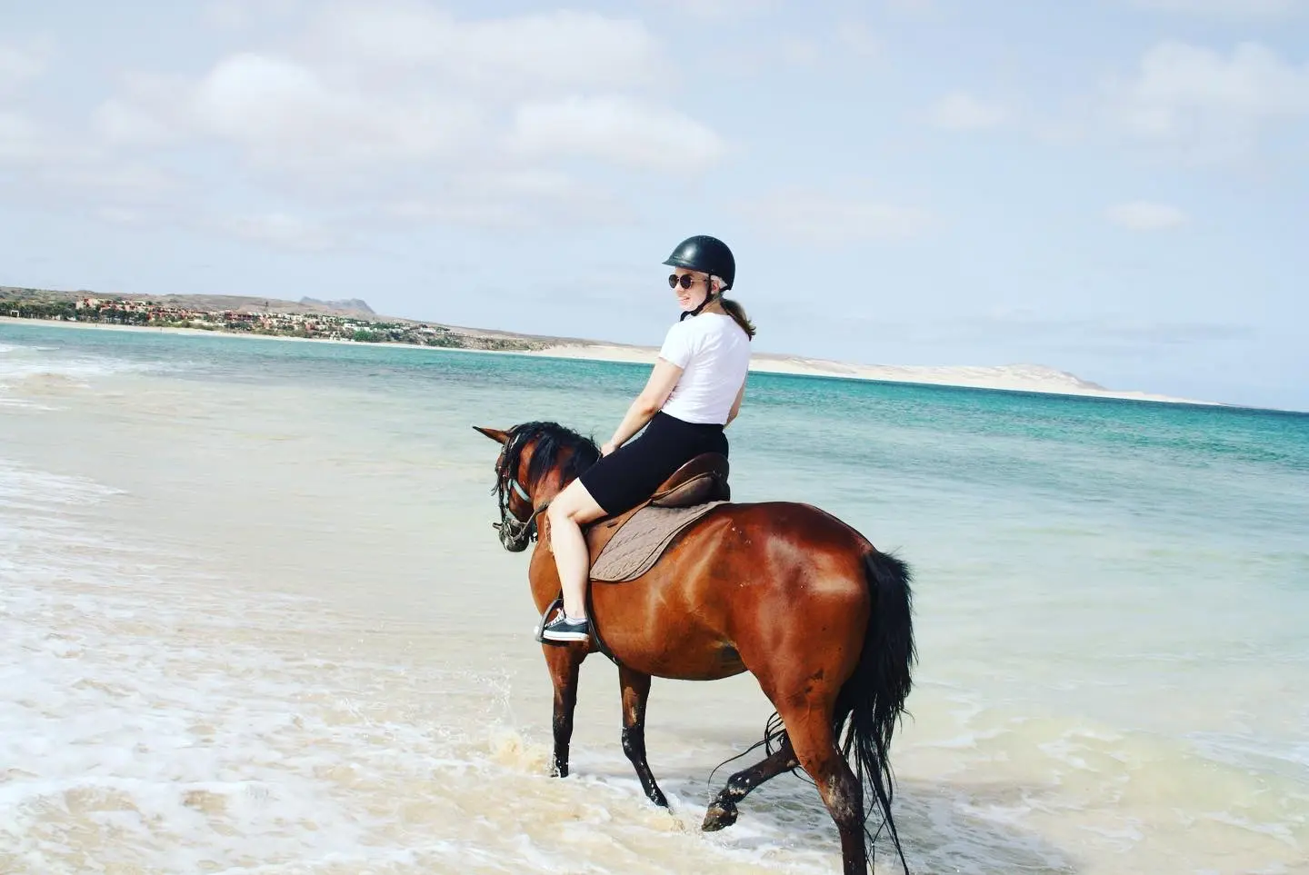Rider enjoying the turquoise Atlantic Ocean on horseback
